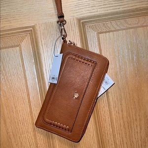 Tan leather wristlet. Brand new with tags
